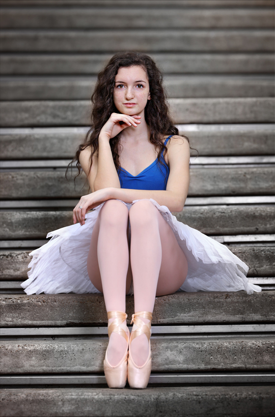 Ballerina poses by the Wortham Center in Downtown Houston
