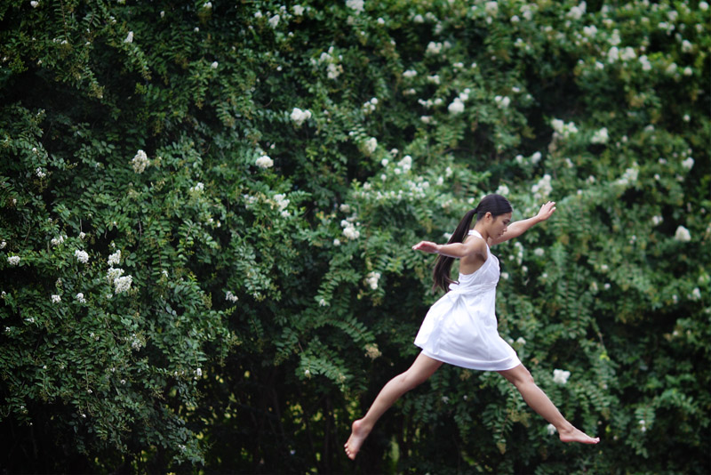Houston Ballerina poses by waterfall in downtown Houston