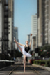 Houston Ballerina poses by Metro Rail in downtown Houston