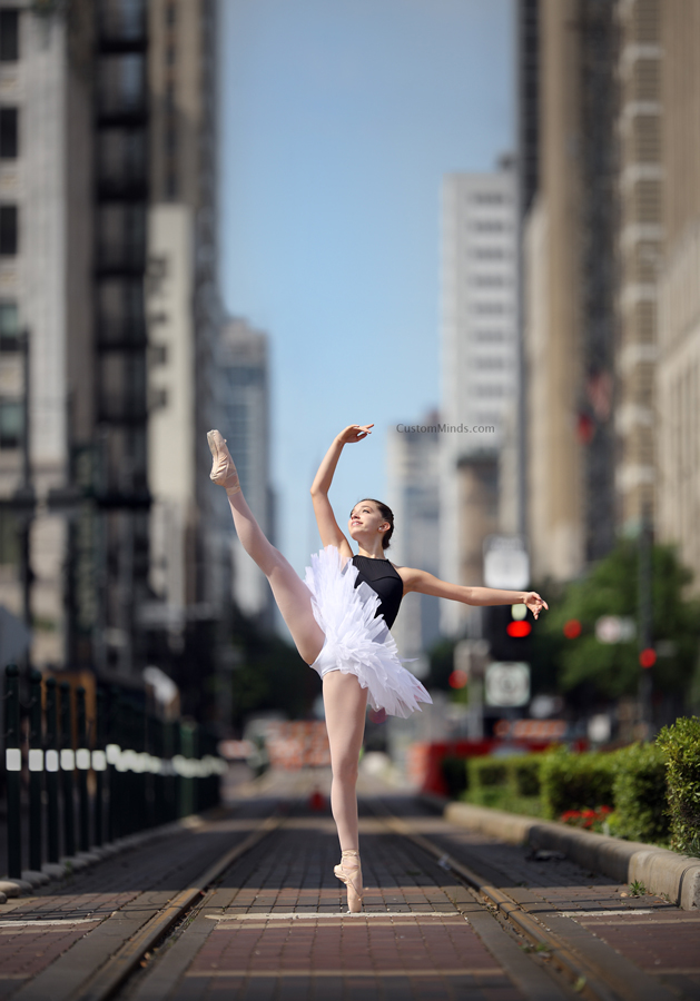 Ballerina poses by the metro rail in downtown Houston