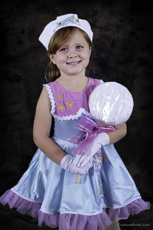 child poses for a dance studio picture
