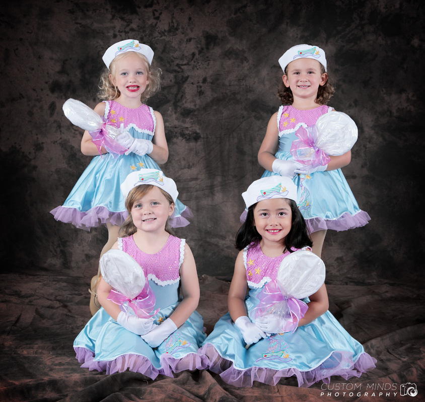 four children pose for a group picture