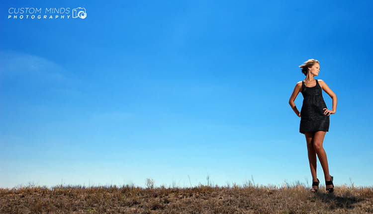 model looking off into the sun