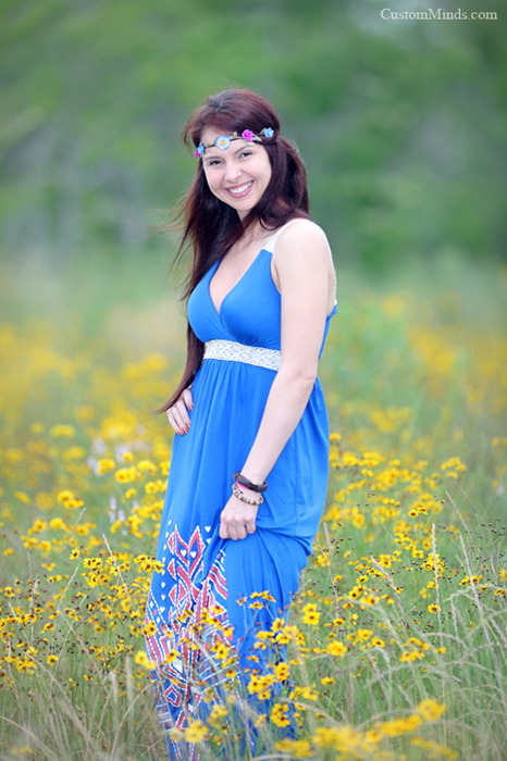 blue dress in a field of yellow flowers