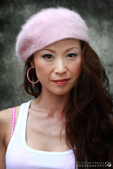 headshot of model with concrete background