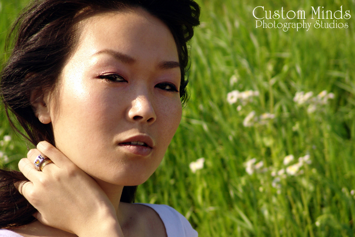 ring with grassy hill in the background