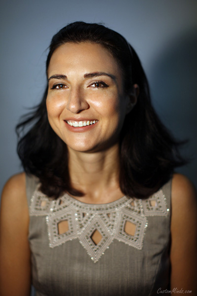 corporate portrait of business woman in gray dress