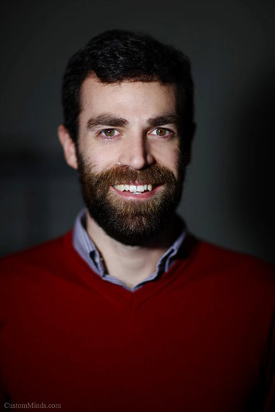 business headshot with man in red sweater