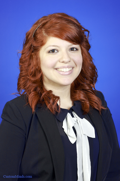 woman in suit with blue background