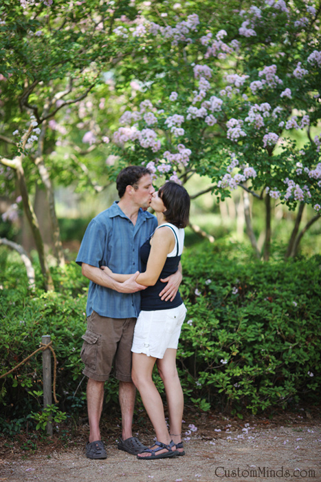 couple kssing at the japanese gardens in hermann park 