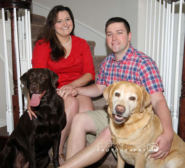 family portrait with pets on the stairs