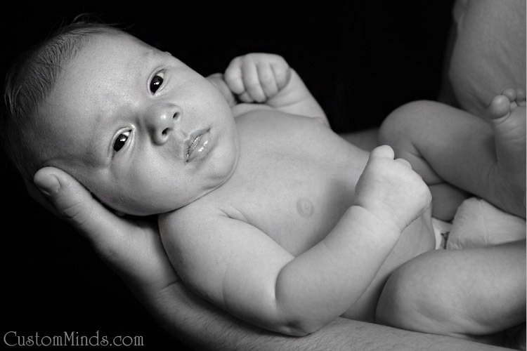 father holding baby