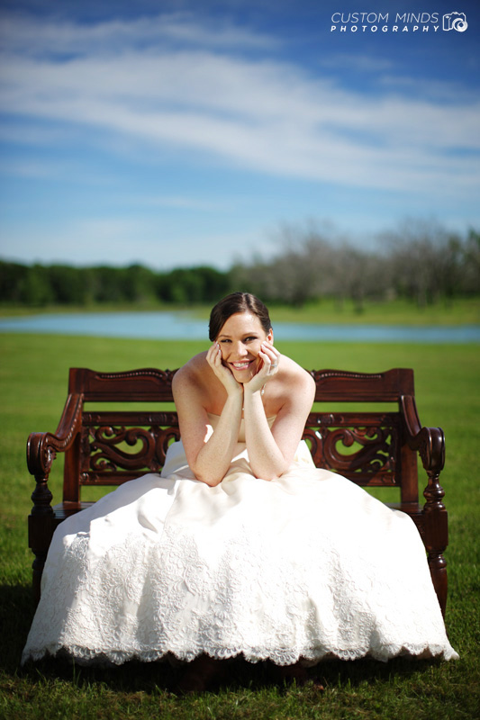 Bride in chair by lake in Richmond Texas