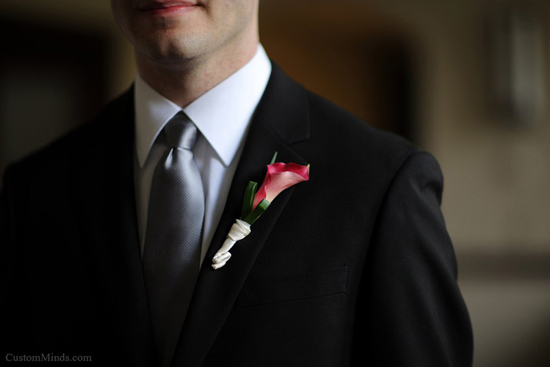 Boutonniere pinned on the Groom