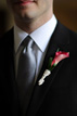 Boutonniere pinned on the Groom