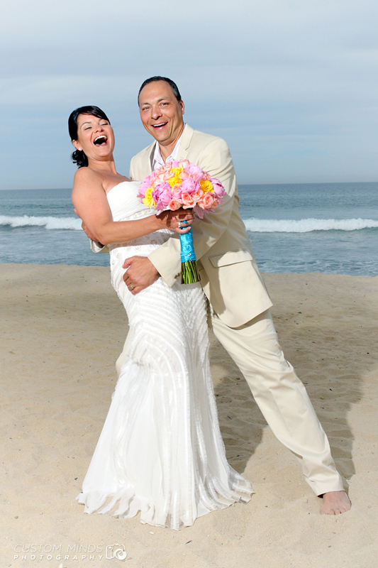 happy Bride and Groom on the beach in Cabo San Lucas, Mexico