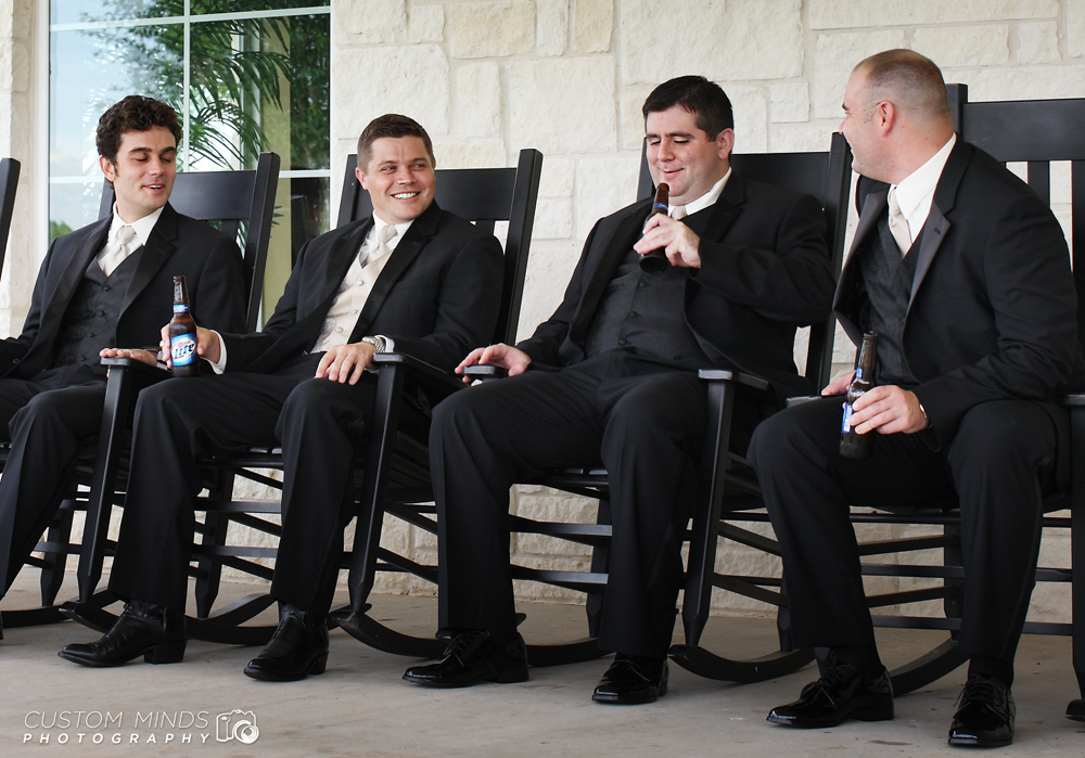 Groom and Groomsmen relaxing on rocking chairs drinking beers