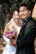 Bride and Groom posing with bouquet in Bryan College Station Texas