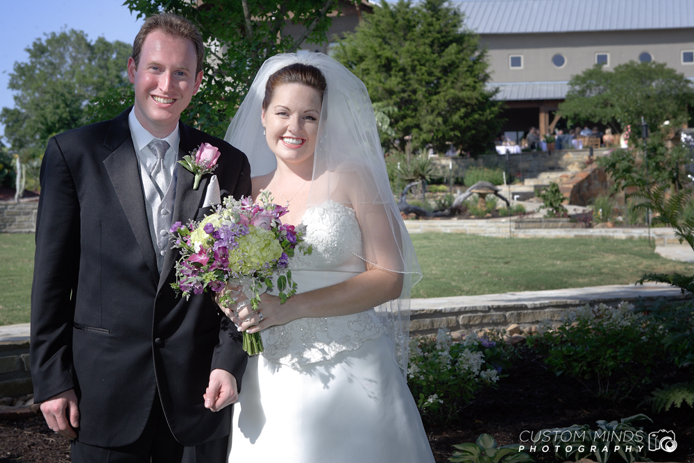 Bride and Groom posing with bouquet in Navasota Texas