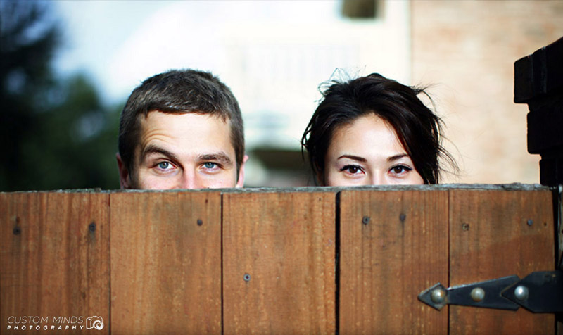 Playing peek-a-boo at an engagement session in Katy Texas