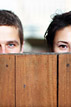 Playing peek-a-boo at an engagement session in Katy Texas