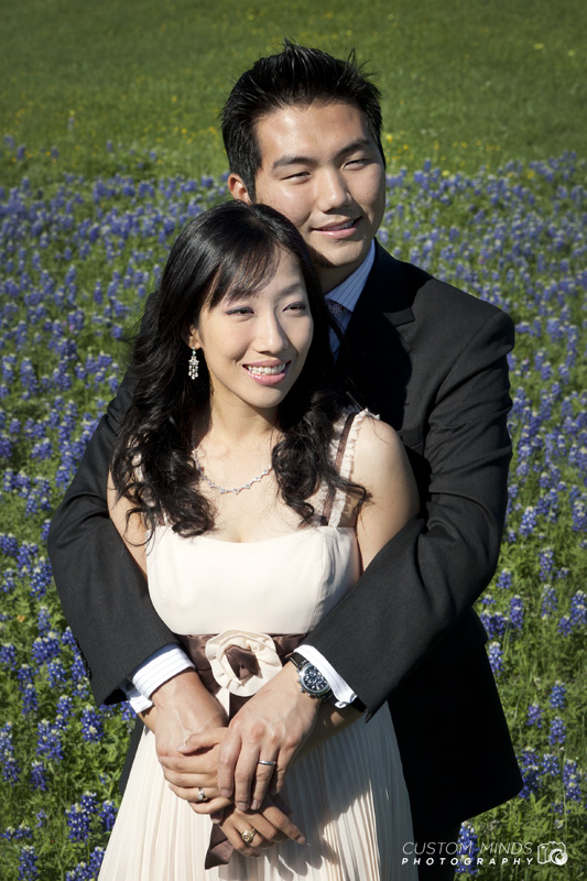 Couple holding each other with Bluebonnets in Navasota Texas