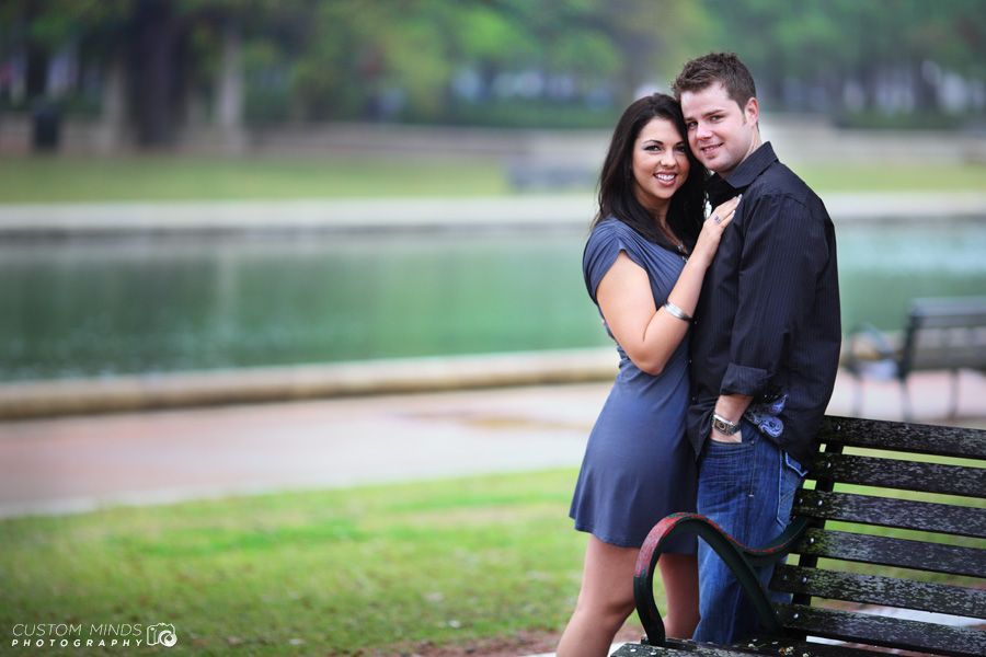 couple photo at Hermann Parks reflection pool during their engagement session