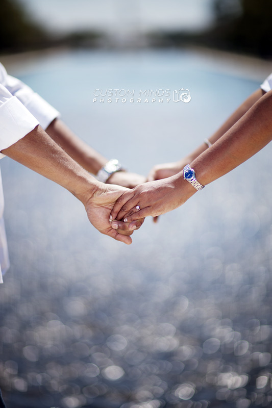 Holding hands by the reflection pond at Hermann Park