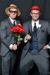 Groomsmen have a fun time in the wedding photo booth