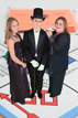 Mother and children pose on a greenscreen Monopoly board for our photo booth