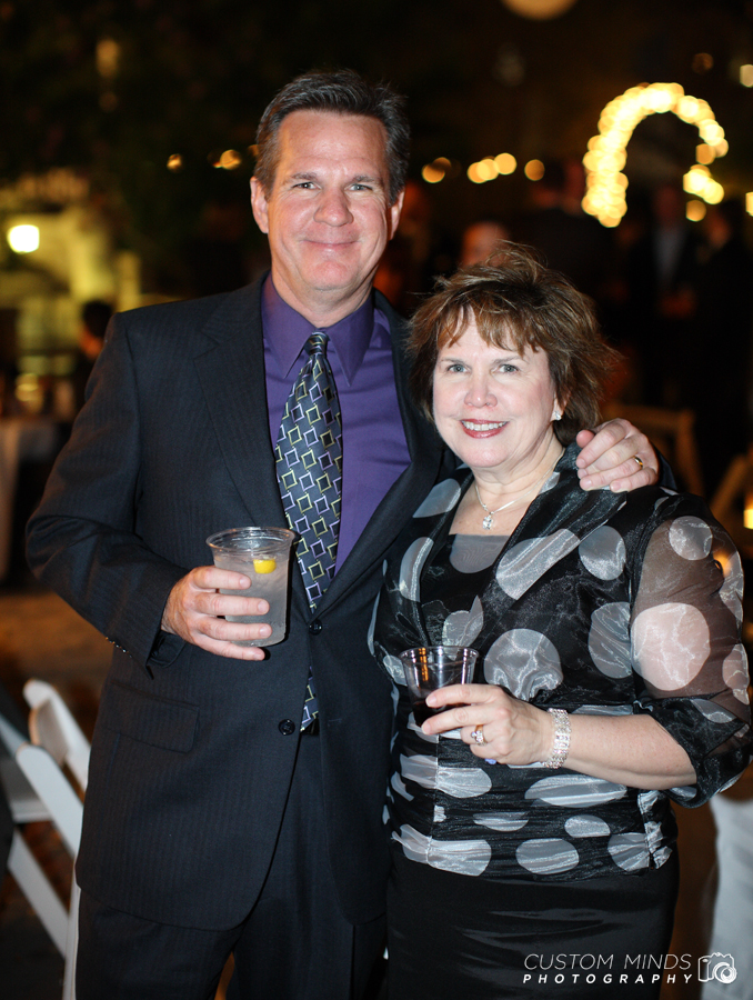 Couple pose during a nighttime wedding reception in Austin Texas