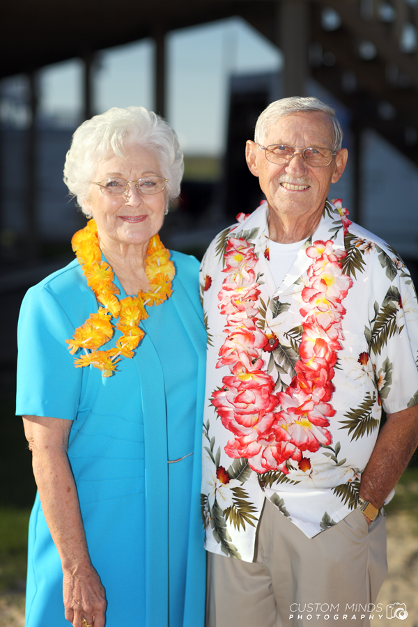 Parents pose for a quick photo at their daughters wedding in Surfside Texas