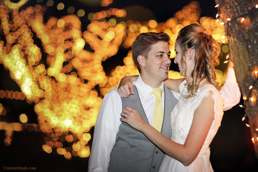 Bride and Groom kissing by the big Oak Tree at Oak Tree Manor in Spring Texas.