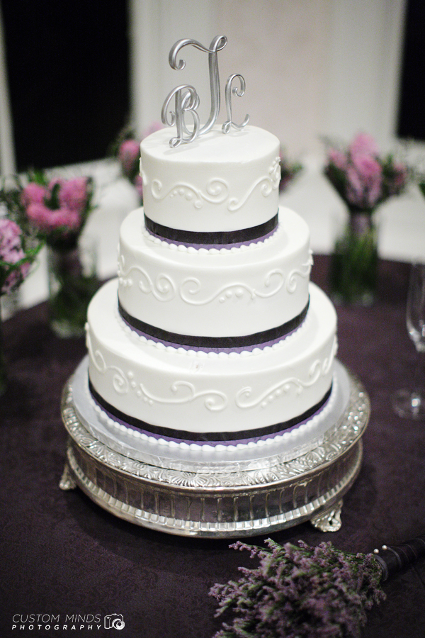 Wedding Cake with surrounding flowers at a reception in Austin Texas