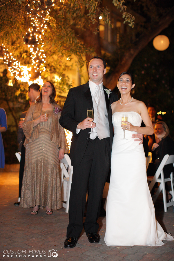 Bride and Groom react to a toast given in their honor
