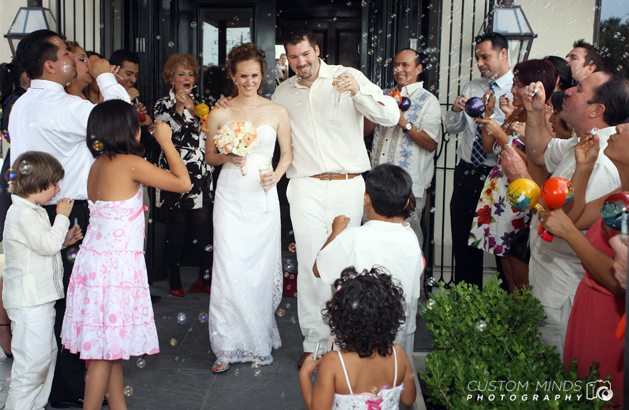 Grand exit with Bride and Groom and bubbles during their River Oaks Wedding