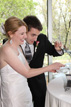 Bride and Groom cut their Wedding cake at The Grove by Discovery Green Park in Houston Texas