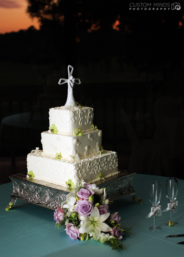 Wedding cake with flowers at a golf reception hall in The Woodlands Texas