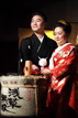 The traditional opening of the Sake during a wedding in Tokyo Japan